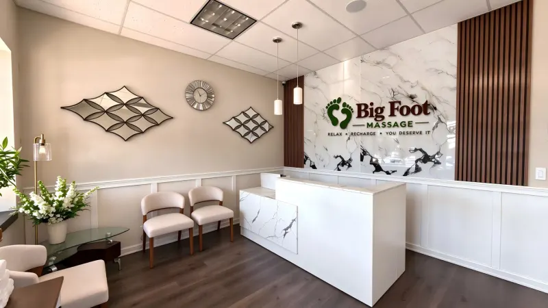 Bright, welcoming reception with the Big Foot Massage sign at our Murfreesboro studio
